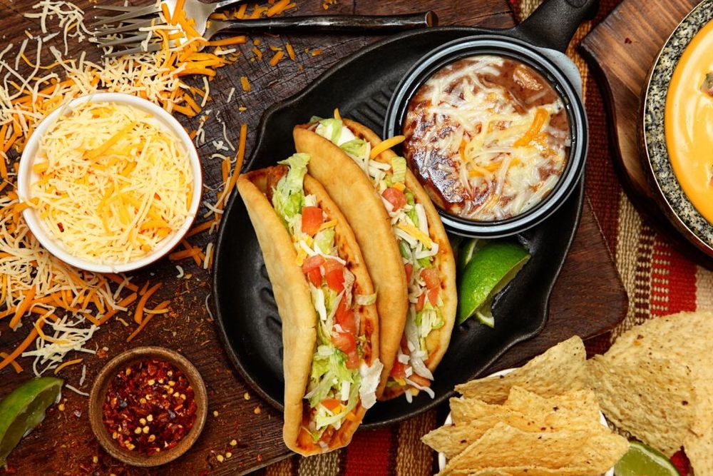 Taco Bell’s Latest Menu Additions Include Bacon-Loaded Chalupas and Nacho Fries